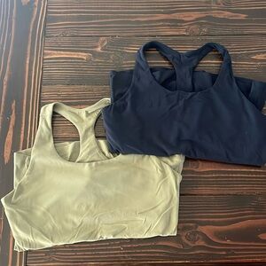 CRZ Yoga tanks one navy blue and one green.